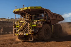 Cat 793F CMD Mining Truck leaving iron ore pit