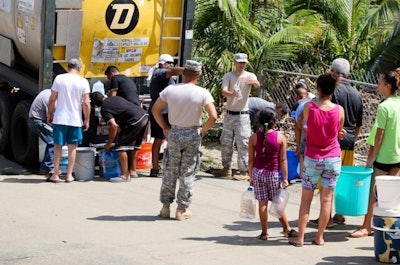 Puerto Rico National Guard Citizen – Soldiers provide water to the San Jose community September 24 following Hurricane Maria. (U.S. Army National Guard photo by Sgt. Alexis Velez)