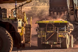 Two Caterpillar 793F CMD autonomous trucks operating at FMG