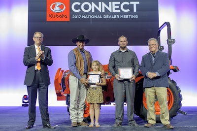 Military veterans Joel Heinzeroth (second from left), with his daughter Emma Carol, and Randy Ramberger (fourth from left) are shown after receiving Kubota tractor donations and Geared to Give awards. Also shown is Alex Woods, Kubota Tractor Corp. vice president of sales operations (far left) and Michael O’Gorman, FVC executive director (far right).