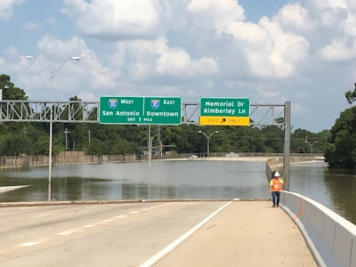Tropical Storm Harvey flooded a section of the Sam Houston Tollway West and a Beltway 8 frontage road at Boheme Drive for nearly two weeks. A sinkhole had also formed beside the frontage road. (The sinkhole can’t be seen in this photo, but it is located just behind the white truck in the left background.) Source: TxDOT