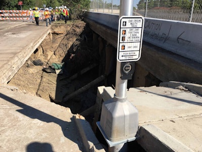 This 20-foot-deep sinkhole formed beside the Beltway 8 frontage road just above the Sam Houston Tollway. Source: TxDOT