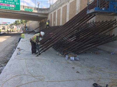 Harper Brothers workers brace the retaining wall between the sinkhole and the Sam Houston Tollway. Source: Joe Harper