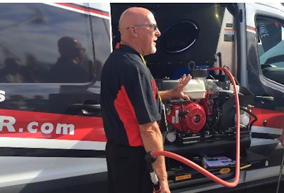 Mike Schaum with VMAC explains features on the Honda-powered G30 gas- engine-driven air compressor at a 2017 ICUEE press event.
