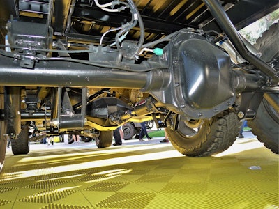 The rearmost axle is the Ford factory unit that has been moved backwards. The middle axle was custom built for this application with a pass-thorough differential. You can lock all four rears. Photo: Tom Jackson