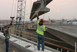 Bridge construction workers steel stock