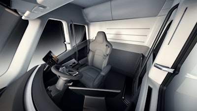 Tesla last November presented a completely reimagined truck interior for its Semi that includes a center-mounted seat, more in the style of a cockpit. On each side of the driver will be large touchscreen displays to house electronic logging applications, navigation, truck information and camera displays.