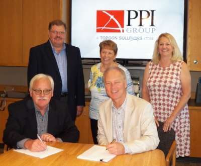 Clockwise, from left, Jamie Williamson of Topcon with Tigue Howe, Jeff Peterson, Joan Peterson and Jean Howe of PPI Group during the signing event for the new PPI Group, Topcon Solutions Store.