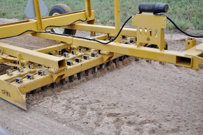 This 12-foot-wide road maintainer from Hoelscher features 37 carbide-tipped spikes.