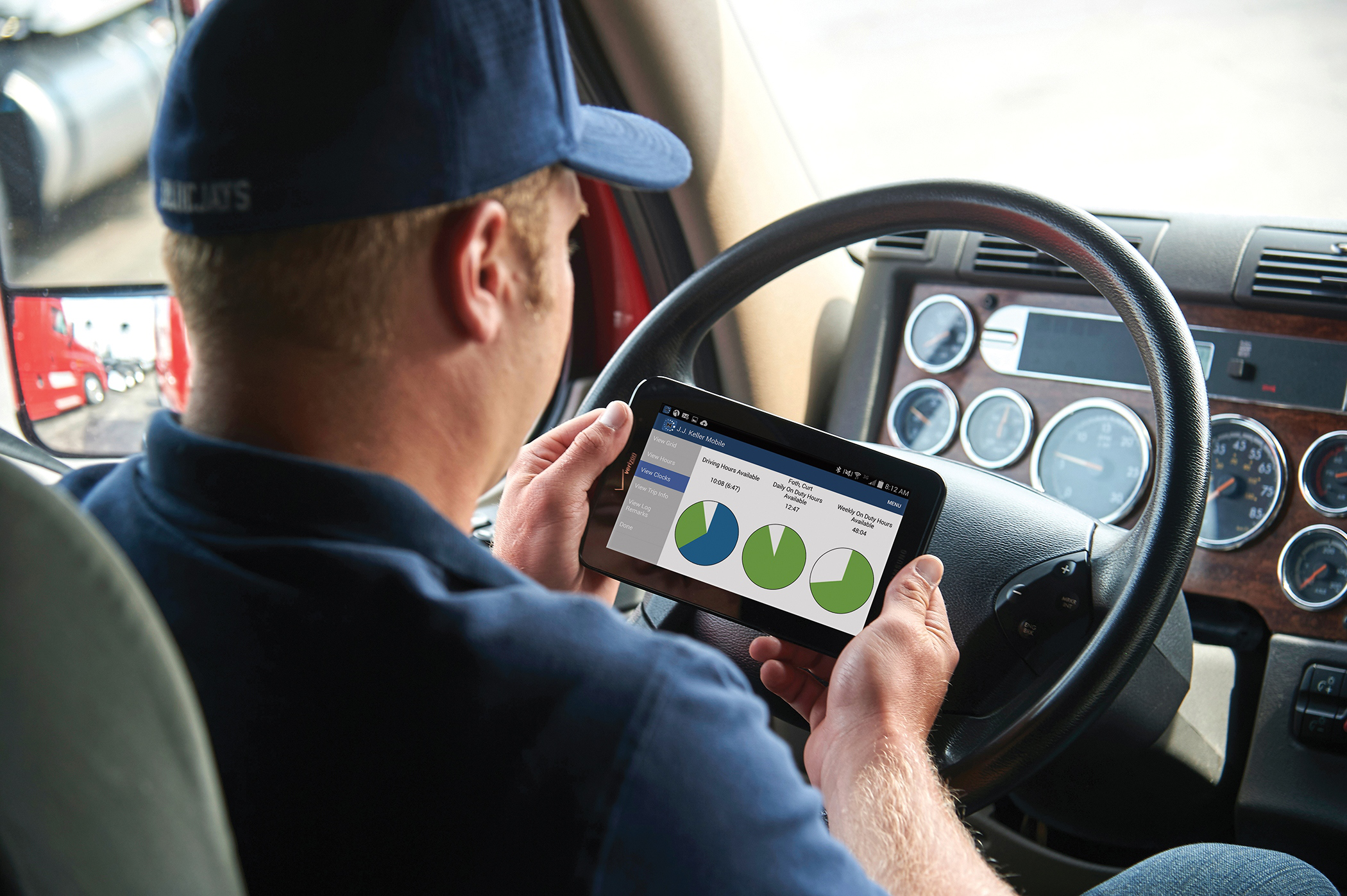 JJ Keller Driver_Adam w_tablet and log screen_D4S3106_clocks ELD