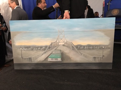 The community of Pt. Pleasant is raising money to paint this mural on the town’s flood wall to remember the 46 people who died on December 15, 1967, when the Silver Bridge collapsed. Photo: West Virginia Department of Transportation