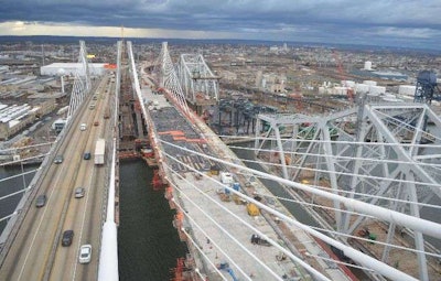 The old Goethels Bridge, seen on the right side of this image, is dismantled alongside the new span. Photo credit: EarthCam via The Port Authority of NY & NJ