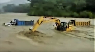 Excavator Rescues Dump Truck Drivers