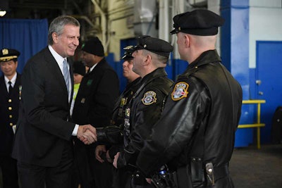 New York City Mayor Bill de Blasio thanks NYPD officers for work on the Vision Zero program to reduce traffic fatalities.