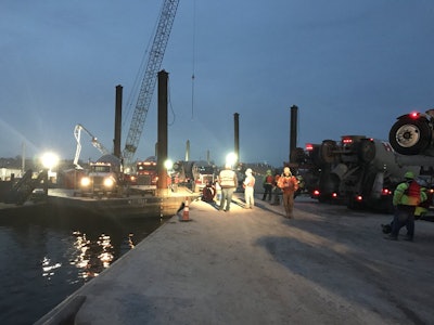 Work occurs on building pier foundations for the future I-74 Mississippi River Bridge.
