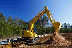 Komatsu PC238LC-11 dumping dirt