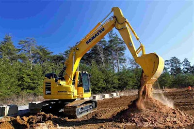 Komatsu PC238LC-11 dumping dirt