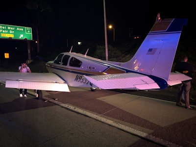 The pilot told authorities he lost power and had to make an emergency landing on the freeway. Photo credit: Costa Mesa Fire Department