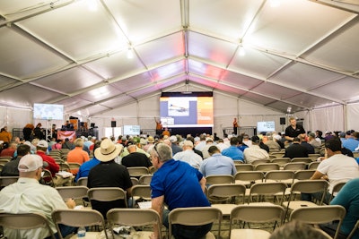 The virtual auction ring, a first at the Orlando auction, allows on-site bidders to view and bid on machines without having to make the walk around the massive auction site. Photo: Wayne Grayson