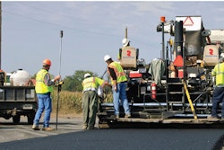 paving crew paver asphalt pavement road crew stock