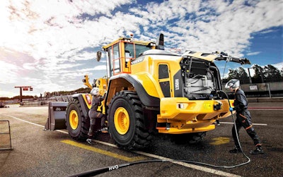 Yellow Volvo L150H large wheel loader being fueled