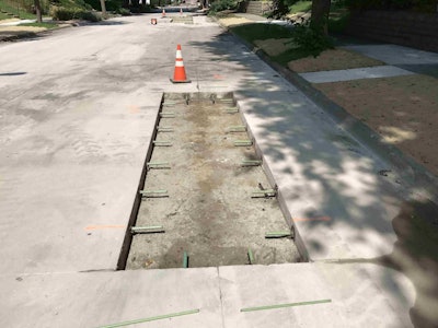 Full depth joint removal under the Concrete Street Rehabilitation Program in Minneapolis. Dowel bars link slabs together at transverse cracks and joints. This helps fix cracked slabs and joint deterioration.