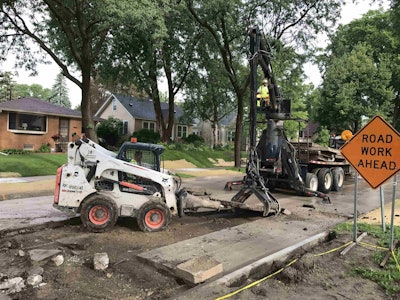 Crews working on a full panel removal in Minneapolis, where the freeze-thaw cycle contributes to potholes and other pavement damage.