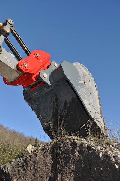 The X-LOCK Coupler connects to the attachment in two places for additional locking force and safety.