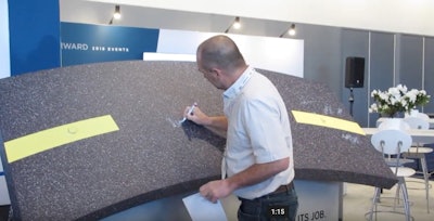 Dave Turin, “Dozer Dave” from Gold Rush, signs asphalt petition at AGG1/World of Asphalt.