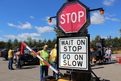 The moving automated flagger assistance device being field tested in Minnesota offers large electronic signage, lights and a traffic bar on a movable platform. The unit is clearly visible to road users and can be operated remotely from 400 feet off the roadway. Photo: MnDOT