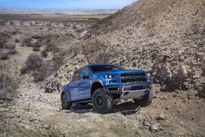 2019 Ford F-150 Raptor off roading up rough hill