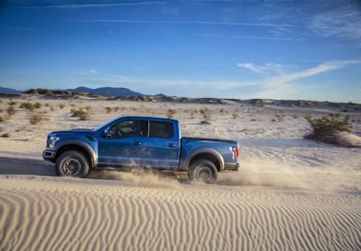2019 Ford F-150 Raptor riding through sand