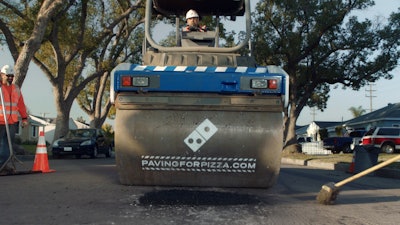 Customers interested in nominating their town for a paving grant from Dominos can enter the zip code at pavingforpizza.com. If their town is selected, the customer will be notified and the city will receive funds to help repair roads so pizzas make it home safely. (PRNewsfoto/Domino’s Pizza)
