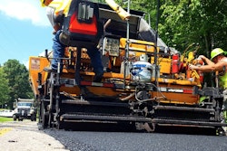 Paving crew paver road work
