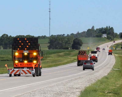 Iowa DOT is trying out a new attenuator, seen here on the left, that alerts drivers to the presence of a road crew with both audible and visual warnings. Photo: Iowa DOT