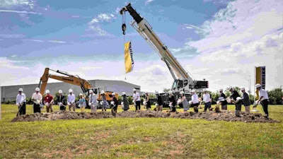 With shovels in hand, Mrs. Sophie Albrecht, Jan Liebherr, Liebherr USA, Co. Managing Directors, its building partners and government officials broke ground during the ceremony. Photo: Liebherr USA