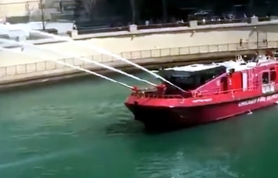 chicago firefighters hose down steel during hot chicago day