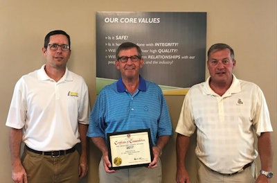 Dan Osborn of Indiana Constructors presents an Associated General Contractors of America certificate of commendation for safety to Walsh & Kelly President Kevin Kelly and Executive Vice President Jeff Swan.