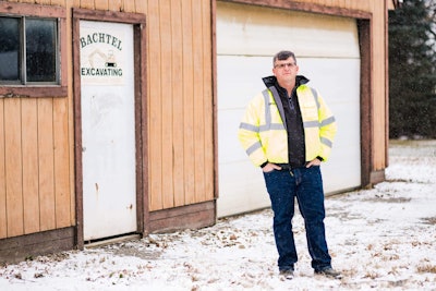 Matt Bachtel stands in front of the barn that served as his company’s original office. Photo: Wayne Grayson