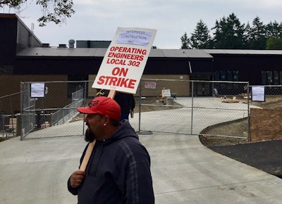 A union member pickets outside new Port Townsend elementary school in Jefferson County, Washington. Photo credit: Jefferson County