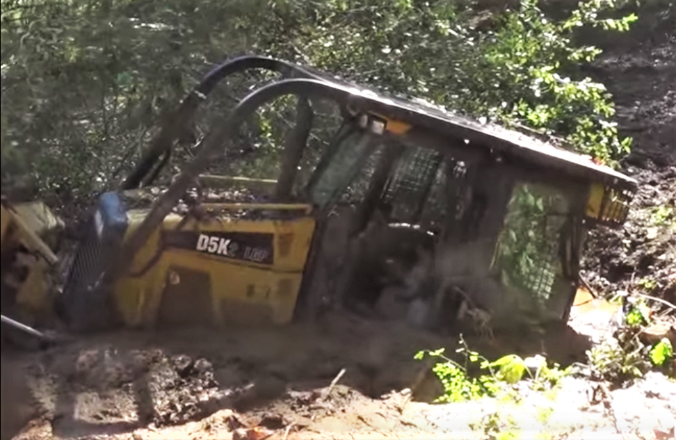CAT D5K dozer stuck in mud
