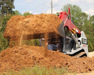 Takeuchi track loader lifting red clay dirt
