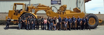 American Independent, Inc. crew standing in front of CAT equipment