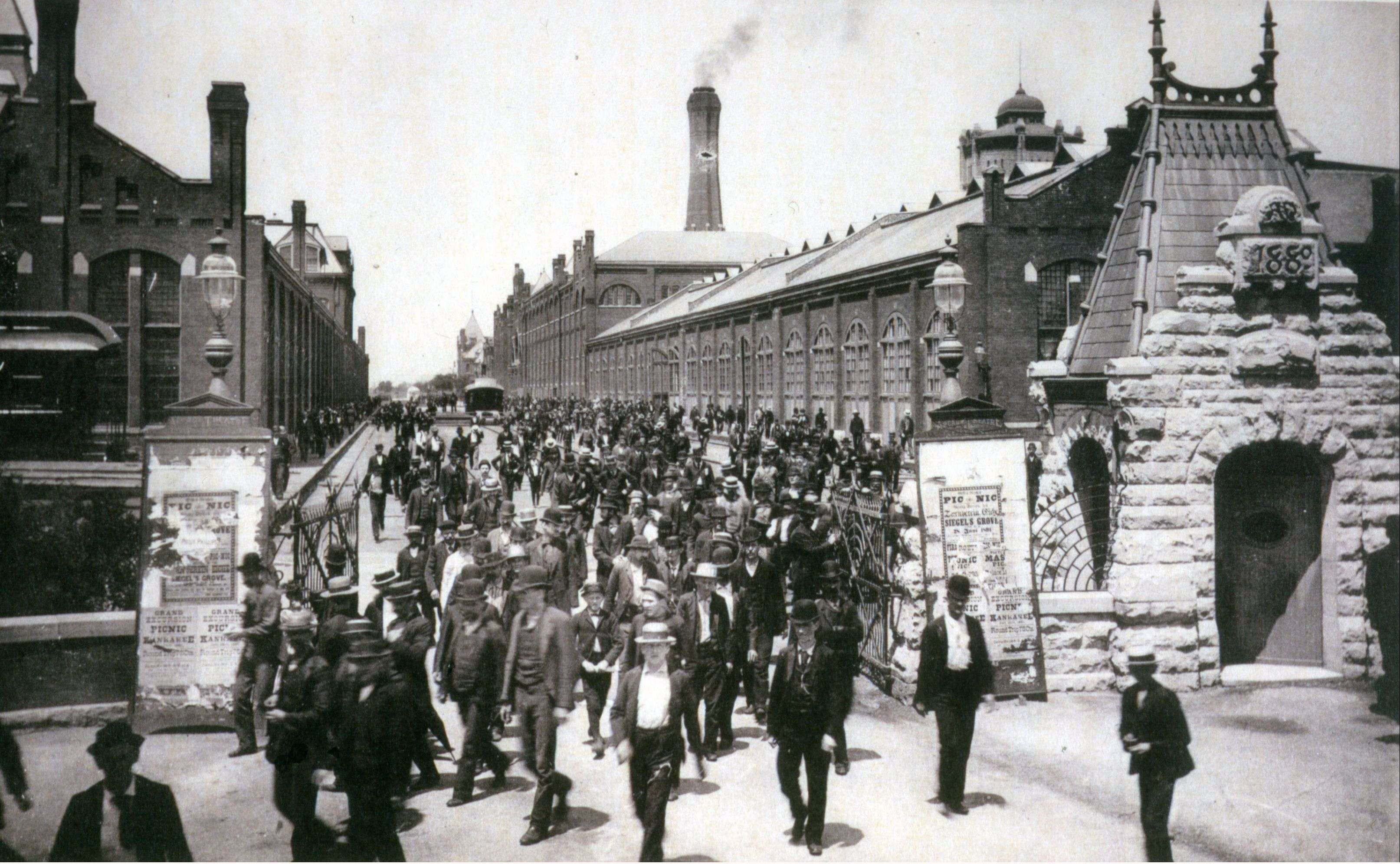 Workers_leave_the_Pullman_Palace_Car_Works,_1893
