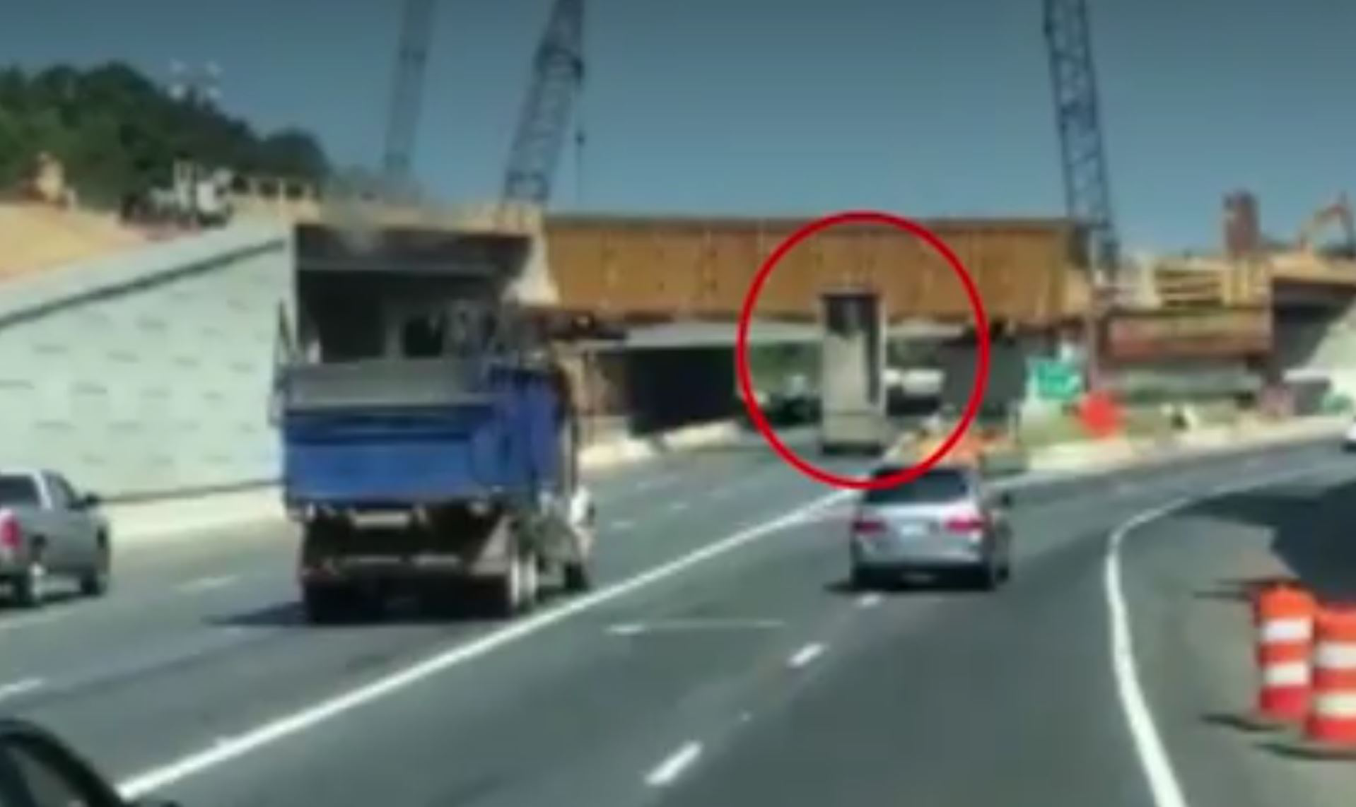 dump truck driver fails to lower bed hits overpass