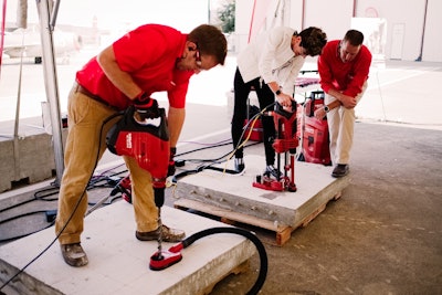 The DD 30-W core rig is demonstrated in the task of setting adhesive anchors in concrete with rebar alongside a combi-hammer.