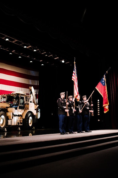 The colors are presented during a ceremony celebrating the 1,000th HMEE at the JCB North America headquarters in Savannah. Photo: Wayne Grayson