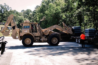 Demonstrating HMEE’s loading capability with pallet forks. Photo: Wayne Grayson