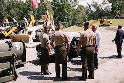 U.S. Marines discuss a demonstration of JCB’s latest military equipment at the company’s North American headquarters in Savannah, Ga. Photo: Wayne Grayson