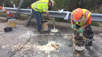 Workers inject polyurethane foam into holes on I-95 to stabilize the interstate after flooding from Hurricane Florence. Photo: NCDOT